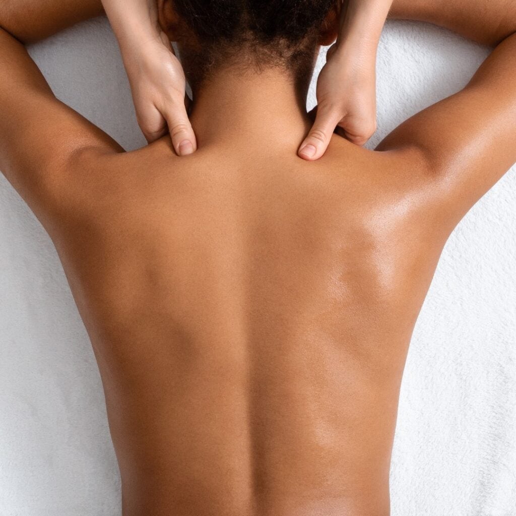 Female client receiving back & neck massage. Massage services provided by Fabulously Beautiful in Sutton Valence, Kent.